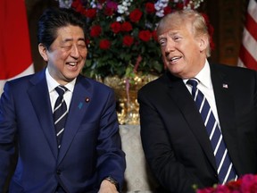 Japanese Prime Minister Shinzo Abe (left) and U.S. President Donald Trump speak during a meeting at Trump's private Mar-a-Lago club, Tuesday, April 17, 2018, in Palm Beach, Fla. (Pablo Martinez Monsivais/AP Photo)