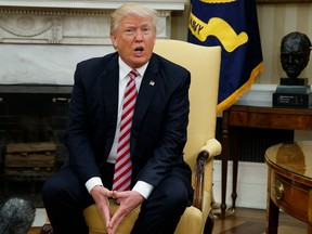 FILE- In this May 10, 2017 file photo, President Donald Trump talks to reporters during a meeting with Dr. Henry Kissinger, former Secretary of State and National Security Advisor under President Richard Nixon, in the Oval Office of the White House in Washington. The presidential news conference, a time-honored tradition going back generations, appears to be no longer. Instead, the president engages the press in more informal settings that aides say offer reporters far more access, more often, than past administrations. (AP Photo/Evan Vucci, File) ORG XMIT: NY603