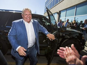 Ontario PC leader Doug Ford arrives during the official opening of the campaign office for Ajax Ontario PC candidate Rod Phillips in Ajax, Ont. on Saturday March 24, 2018. Ernest Doroszuk/Toronto Sun/Postmedia Network