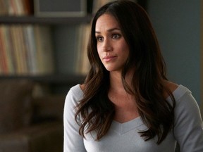 In this image released by USA Network, Meghan Markle appears in a scene from "Suits." Show creator and showrunner Aaron Korsh has written an on-screen wedding for Markle's paralegal-turned-lawyer character Rachel Zane, who will finally exchange vows during the April 25 season seven finale with her longtime love Mike Ross, played by Patrick Adams. (Ian Watson/USA Network via AP) ORG XMIT: NYET461