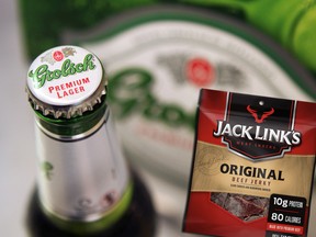 Bottles of Grolsch beer, produced by SABMiller Plc, are arranged for a photograph in London, U.K., on Tuesday, Oct. 18, 2011 alongside Jack Link's original beef jerky.
