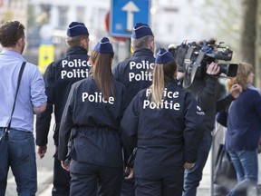 Police patrol outside the Brussels justice palace during the trial of Saleh Abdeslam and Soufiane Ayari in Brussels, Monday, April 23, 2018. The sole surviving suspect in the 2015 Paris extremist attacks who was once Europe's most wanted fugitive will hear his judgment in an attempted murder case on Monday. Salah Abdeslam's verdict will be heard for his involvement in a March 15, 2016, police shootout, four months after the Paris attacks that killed 130.