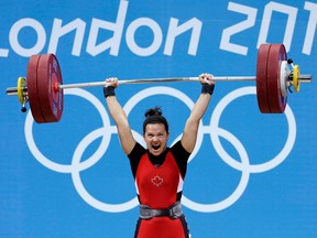Christine Girard of Canada competes during the women's 63 kg weightlifting competition at the Olympics on July 31, 2012