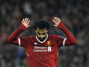 Liverpool's Mohamed Salah celebrates after scoring his side's second goal during the Champions League semifinal against Roma at Anfield Stadium, Liverpool, England, Tuesday, April 24, 2018.