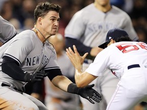 Tyler Austin of the New York Yankees fights Joe Kelly of the Boston Red Sox after being stuck by a pitch at Fenway Park on April 11, 2018 in Boston. (Maddie Meyer/Getty Images)