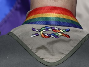 In this June 8, 2014, file photo, a Boy Scout wears his kerchief embroidered with a rainbow knot during Salt Lake City's annual gay pride parade. (AP)