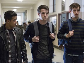 This image released by Netflix shows, from left, Christian Navarro, Dylan Minnette and Brandon Flynn in "13 Reasons Why."  (Beth Dubber/Netflix via AP)