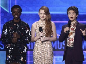 Kaleb McLoughlin, from left, Sadie Sink, and Gaten Matarazzo introduce a performance by Alessia Cara and Zedd at the American Music Awards at the Microsoft Theater on Sunday, Nov. 19, 2017, in Los Angeles.