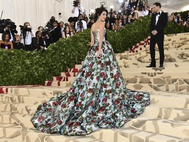 Amal Clooney attends The Metropolitan Museum of Art's Costume Institute benefit gala celebrating the opening of the Heavenly Bodies: Fashion and the Catholic Imagination exhibition on Monday, May 7, 2018, in New York.