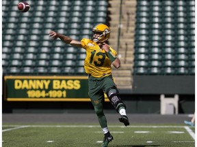 Mike Reilly (13) takes part in the opening day of the Edmonton Eskimos' training camp at Commonwealth Stadium, in Edmonton Sunday May 20, 2018.