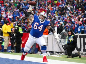 Richie Incognito of the Buffalo Bills spikes the ball after LeSean McCoy of the Buffalo Bills scored a touchdown during the first quarter against the Miami Dolphins on December 17, 2017 at New Era Field in Orchard Park, New York.  (Tom Szczerbowski/Getty Images)