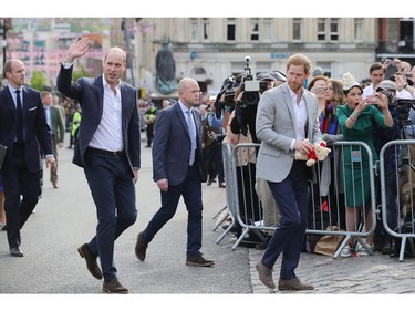 WINDSOR, ENGLAND - MAY 18:  (L-R)  Prince William, Duke of Cambridge and Prince Harry embark on a walkabout ahead of the royal wedding of Prince Harry and Meghan Markle on May 18, 2018 in Windsor, England.