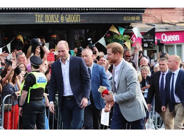 WINDSOR, ENGLAND - MAY 18:  Prince Harry (R) and Prince William meet the public during a pre wedding walkabout ahead of the royal wedding of Prince Harry to Meghan Markle on May 18, 2018 in Windsor, England.