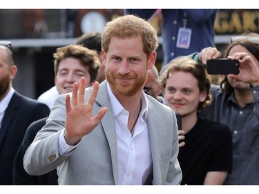 WINDSOR, ENGLAND - MAY 18:  Prince Harry greets members of the public as he embarks on a walkabout  ahead of the royal wedding of Prince Harry and Meghan Markle on May 18, 2018 in Windsor, England.