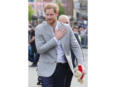 WINDSOR, ENGLAND - MAY 18:  Prince Harry greets members of the public as he embarks on a walkabout  ahead of the royal wedding of Prince Harry and Meghan Markle on May 18, 2018 in Windsor, England.