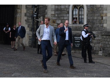 WINDSOR, ENGLAND - MAY 18:  (L-R) Prince Harry and  Prince William, Duke of Cambridge embark on a walkabout ahead of the royal wedding of Prince Harry and Meghan Markle on May 18, 2018 in Windsor, England.