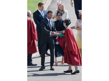 WINDSOR, ENGLAND - MAY 19:  David and Victoria Beckham attend the wedding of Prince Harry to Ms Meghan Markle at St George's Chapel, Windsor Castle on May 19, 2018 in Windsor, England. Prince Henry Charles Albert David of Wales marries Ms. Meghan Markle in a service at St George's Chapel inside the grounds of Windsor Castle. Among the guests were 2200 members of the public, the royal family and Ms. Markle's Mother Doria Ragland.