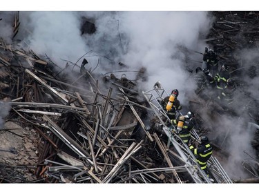 Firefighters work to extinguish the fire in a building that collapsed after catching fire in Sao Paulo, Brazil, on May 1, 2018.