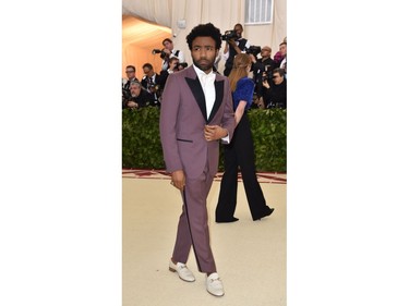 Donald Glover arrives for the 2018 Met Gala on May 7, 2018, at the Metropolitan Museum of Art in New York. The Gala raises money for the Metropolitan Museum of Arts Costume Institute. The Gala's 2018 theme is Heavenly Bodies: Fashion and the Catholic Imagination.
