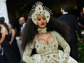 Cardi B arrives for the 2018 Met Gala on May 7, 2018, at the Metropolitan Museum of Art in New York. The Gala raises money for the Metropolitan Museum of Arts Costume Institute. The Gala's 2018 theme is Heavenly Bodies: Fashion and the Catholic Imagination.