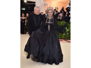 Madonna (R) and Jean Paul Gaultier arrive for the 2018 Met Gala on May 7, 2018, at the Metropolitan Museum of Art in New York. The Gala raises money for the Metropolitan Museum of Arts Costume Institute. The Gala's 2018 theme is Heavenly Bodies: Fashion and the Catholic Imagination.