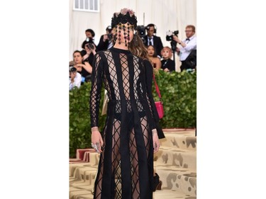 Cara Delevingne arrives for the 2018 Met Gala on May 7, 2018, at the Metropolitan Museum of Art in New York. The Gala raises money for the Metropolitan Museum of ArtÃ¢â¬â¢s Costume Institute. The Gala's 2018 theme is Ã¢â¬ÅHeavenly Bodies: Fashion and the Catholic Imagination.Ã¢â¬ï¿½