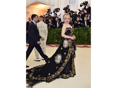 Emilia Clarke arrives for the 2018 Met Gala on May 7, 2018, at the Metropolitan Museum of Art in New York. The Gala raises money for the Metropolitan Museum of Arts Costume Institute. The Gala's 2018 theme is Heavenly Bodies: Fashion and the Catholic Imagination.