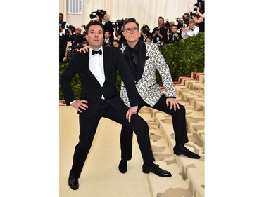 Jimmy Fallon (L) and Stephen Colbert arrive for the 2018 Met Gala on May 7, 2018 at the Metropolitan Museum of Art in New York. The Gala raises money for the Metropolitan Museum of Arts Costume Institute. The Gala's 2018 theme is Heavenly Bodies: Fashion and the Catholic Imagination.