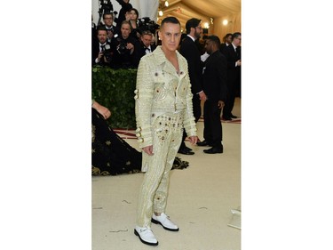 Jeremy Scott arrives for the 2018 Met Gala on May 7, 2018, at the Metropolitan Museum of Art in New York. The Gala raises money for the Metropolitan Museum of Arts Costume Institute. The Gala's 2018 theme is Heavenly Bodies: Fashion and the Catholic Imagination.