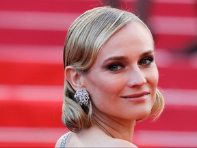 German actress Diane Kruger poses as she arrives on May 13, 2018 for the screening of the film "Sink Or Swim (Le Grand Bain)" at the 71st edition of the Cannes Film Festival in Cannes, southern France. (Valery Hache/Getty Images)
