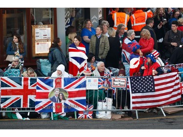 Well-wishers gather outside Windsor Castle on Castle Hill ahead of the wedding and carriage procession of Britain's Prince Harry and Meghan Markle in Windsor, on May 19, 2018.