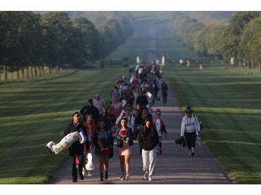 Well wishers arrive on the Long Walk leading to Windsor Castle ahead of the wedding and carriage procession of Britain's Prince Harry and Meghan Markle in Windsor, on May 19, 2018.