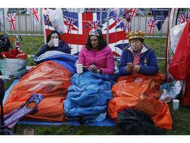 Well-wishers wake up on the Long Walk leading to Windsor Castle ahead of the wedding and carriage procession of Britain's Prince Harry and Meghan Markle in Windsor, on May 19, 2018.