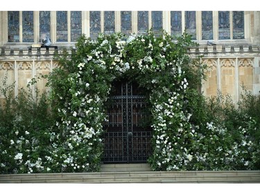Flowers and foliage adorn the West door and steps of St George's Chapel for the wedding ceremony of Britain's Prince Harry and US actress Meghan Markle at Windsor Castle, in Windsor on May 19, 2018.