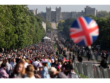 Well-wishers line the Long Walk leading to Windsor Castle ahead of the wedding and carriage procession of Britain's Prince Harry and Meghan Markle in Windsor, on May 19, 2018.