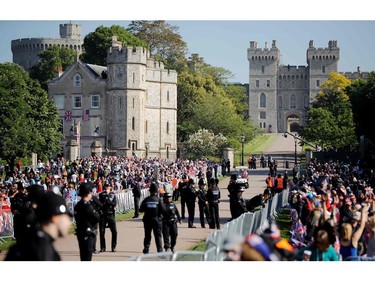 Well-wishers gather along the Long Walk leading to Windsor Castle ahead of the wedding and carriage procession of Britain's Prince Harry and Meghan Markle in Windsor, on May 19, 2018.