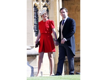 Britain's Catherine, Duchess of Cambridge's former private secretary, Rebecca Deacon (L) and Gibraltarian footballer, Adam Priestley arrive for the wedding ceremony of Britain's Prince Harry, Duke of Sussex and US actress Meghan Markle at St George's Chapel, Windsor Castle, in Windsor, on May 19, 2018.