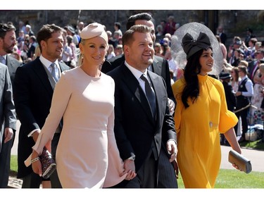 British presenter James Corden and Julia Carey arrive for the wedding ceremony of Britain's Prince Harry, Duke of Sussex and US actress Meghan Markle at St George's Chapel, Windsor Castle, in Windsor, on May 19, 2018.