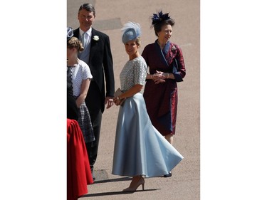 Britain's Sophie, Countess of Wessex, (C) arrives followed by Britain's Princess Anne, Princess Royal, (R) and Vice Admiral Timothy Laurence (L) arrive for the wedding ceremony of Britain's Prince Harry, Duke of Sussex and US actress Meghan Markle at St George's Chapel, Windsor Castle, in Windsor, on May 19, 2018.