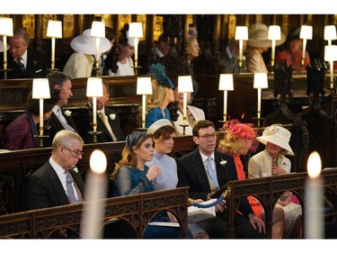(L-R) The Duke of York, Princess Beatrice, Princess Eugenie and Jack Brooksbank sit ahead of the wedding ceremony of Britain's Prince Harry, Duke of Sussex and US actress Meghan Markle in St George's Chapel, Windsor Castle, in Windsor, on May 19, 2018.