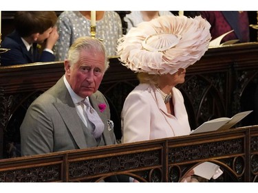 Britain's Prince Charles, Prince of Wales and Britain's Camilla, Duchess of Cornwall wait in the chapel for the wedding ceremony of Britain's Prince Harry, Duke of Sussex and US actress Meghan Markle in St George's Chapel, Windsor Castle, in Windsor, on May 19, 2018.