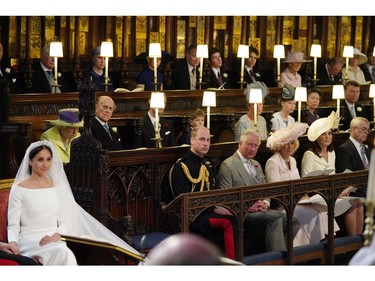 US fiancee of Britain's Prince Harry Meghan Markle (L) in St George's Chapel, Windsor Castle for her wedding to Britain's Prince Harry, Duke of Sussex, watched by (middle row L-R) Britain's Queen Elizabeth II, Britain's Prince Philip, Duke of Edinburgh, Britain's Prince Edward, Earl of Wessex, Page boy James, Viscount Severn, Britain's Sophie, Countess of Wessex, Britain's Lady Louise Windsor, Britain's Princess Anne, Princess Royal, Vice Admiral Timothy Laurence, (front row L-R) Britain's Prince William, Duke of Cambridge, Britain's Prince Charles, Prince of Wales, Britain's Camilla, Duchess of Cornwall, Duchess of Britain's Catherine, Duchess of Cambridge, and Britain's Prince Andrew, Duke of York. in the chapel for the wedding ceremony of Britain's Prince Harry, Duke of Sussex and US actress Meghan Markle in St George's Chapel, Windsor Castle, in Windsor, on May 19, 2018.