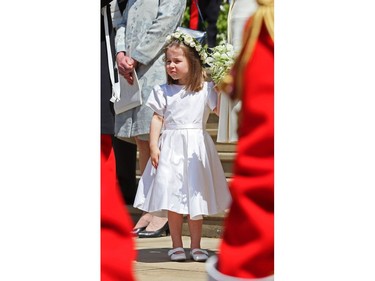 Prince Harry's niece and bridesmaid Princess Charlotte leaves after attending the wedding ceremony of Britain's Prince Harry, Duke of Sussex and US actress Meghan Markle at St George's Chapel, Windsor Castle, in Windsor, on May 19, 2018.