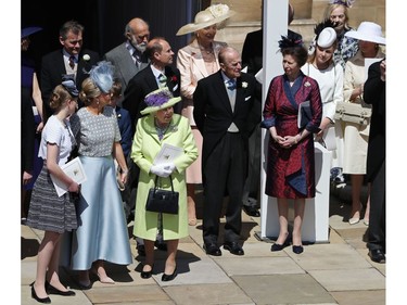 Members of the Royal family gather to watch Britain's Prince Harry, Duke of Sussex and his wife Meghan, Duchess of Sussex begin their carriage procession in the Ascot Landau Carriage after their wedding ceremony at St George's Chapel, Windsor Castle, in Windsor, on May 19, 2018.