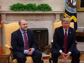 U.S. President Donald Trump speaks to the press with Joshua Holt, who had been detained in Venezuela for two years, in the Oval Office at the White House in Washington, D.C., on May 26, 2018. (NICHOLAS KAMM/AFP/Getty Images)