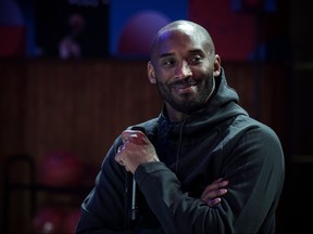 Former NBA basketball player Kobe Bryant attends a promotional event organized by the sports brand Nike, for the inauguration of the infrastructure improvements of a local basketball playground at the Jean-Jaures sports hall "Le Quartier", in Paris on October 21, 2017. (Philippe Lopez/Getty Images)