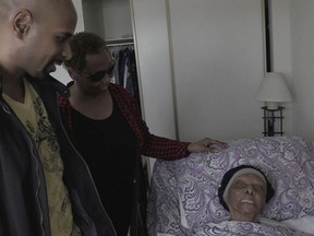 In this May 11, 2018 frame from video, family members stop by to visit with Lessie Brown, who is 113, in Cleveland Heights, Ohio. She is believed to be the oldest person in the United States after the death of a 114-year-old Pennsylvania woman. (David Petkiewicz/The Plain Dealer via AP)