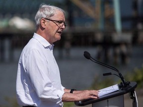 Marc Garneau, Minister of Transport, makes an announcement regarding the Oceans Protection Plan in Vancouver, B.C., on Wednesday May 16, 2018. A plan to 'triage' asylum seekers crossing the Canada-U.S. border illegally in order to move some migrants out of Quebec and into Ontario has stalled because Ontario is in the midst of a provincial election.