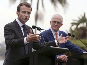 French President Emmanuel Macron, left, speaks as Australian Prime Minister Malcolm Turnbull listens during a joint press conference in Sydney, Wednesday, May 2, 2018.