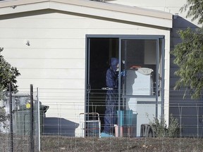 Police forensics investigate the death of seven people in a suspected murder-suicide in Osmington, east of Margaret River, south west of Perth, Australia Friday, May 11, 2018. Seven people including four children were found dead with gunshot wounds Friday at a rural property in southwest Australia in what could be the country's worst mass shooting in 22 years, police said.